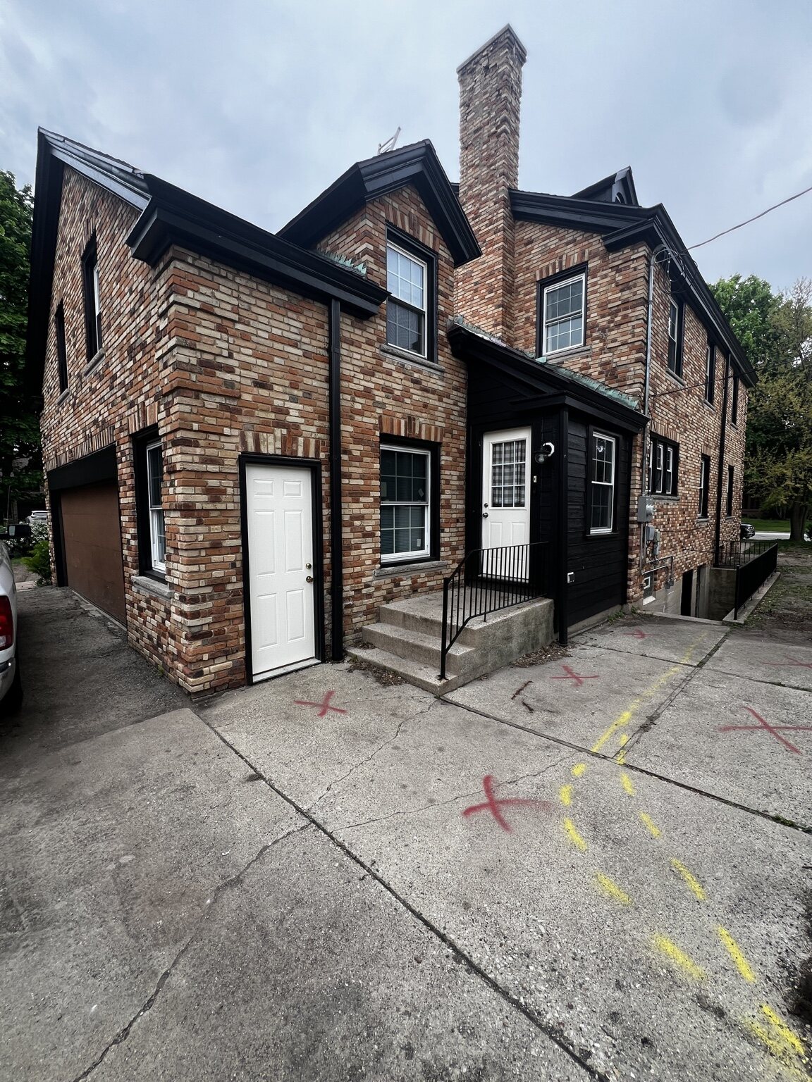 Brick home exterior with freshly painted trim