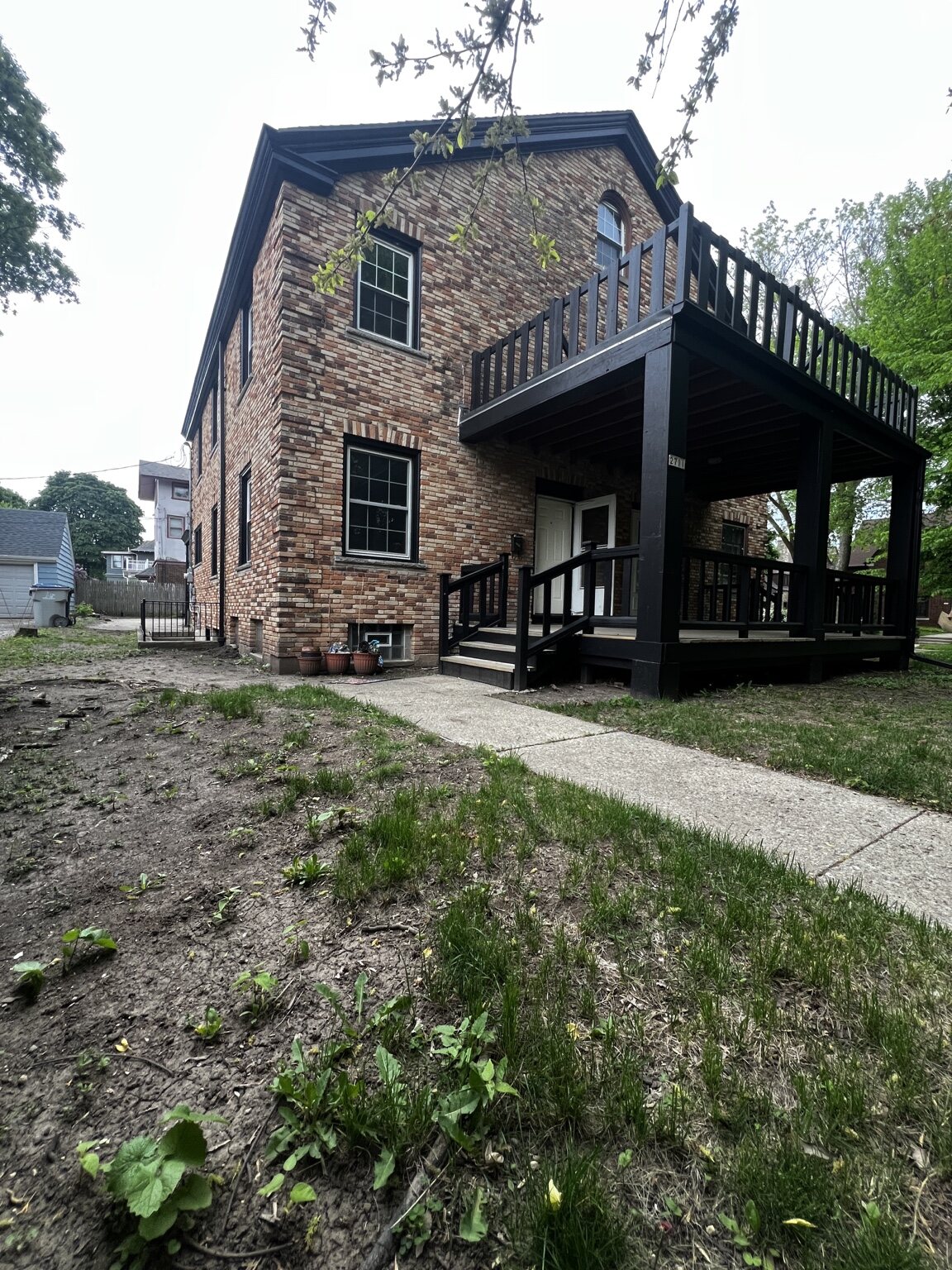Rear elevation and porch of brick home