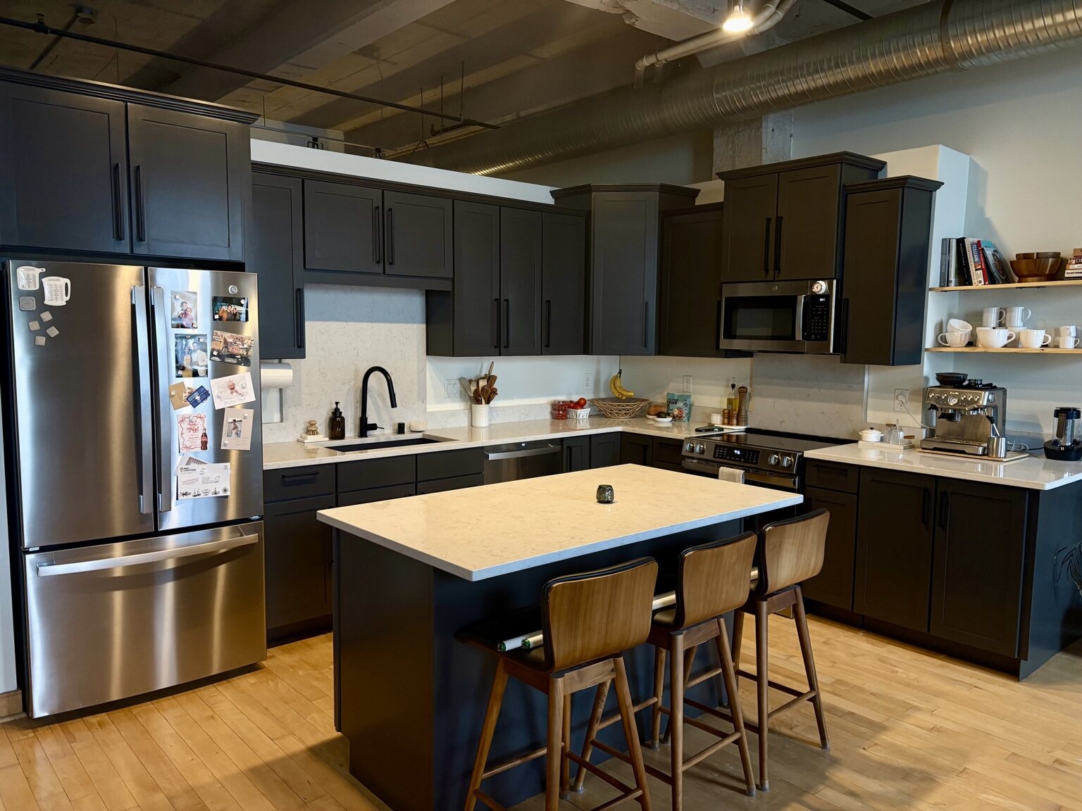 Dark refinished kitchen cabinets and island
