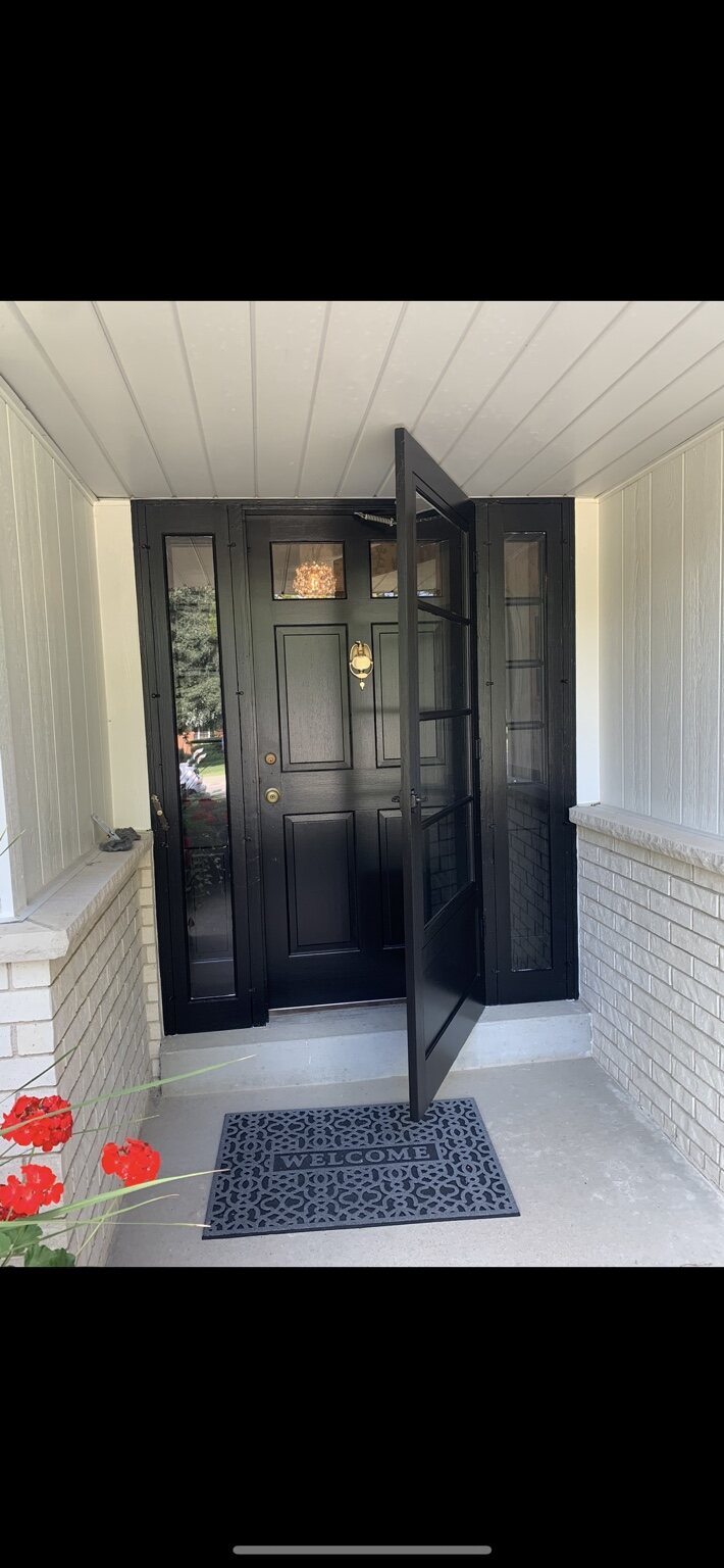 Freshly painted front door and entry trim